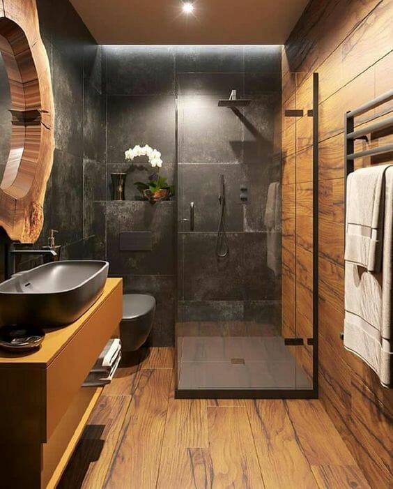 łazienka w drewnie z czarnymi kafelkami